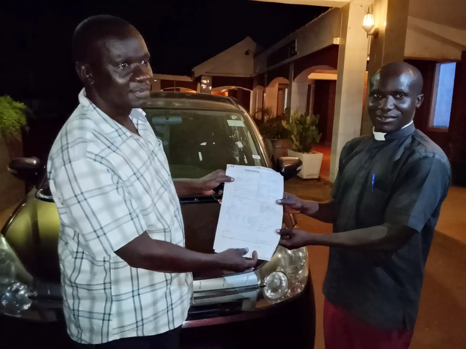 Minister Engola Delivers Promised Vehicle to Abunga Parish Reverend